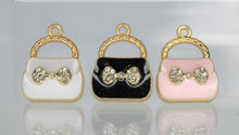 Load image into Gallery viewer, Purse Charms, Pink, White or Black purse charms. They have a rhinestone bow in front. They are adorable. Check them out.