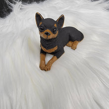Load image into Gallery viewer, Black and Tan Chihuahua figurine made of concrete.
