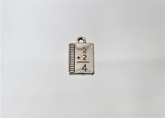 Notebook Charms, These small math notebooks do the math for you. They are a reminder of our younger years. Check them out