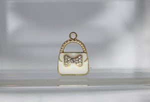 Purse Charms,  Pink, White or Black purse charms. They have a rhinestone bow in front. They are adorable. Check them out.