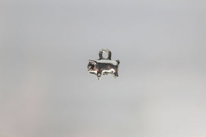 Pig Charms, These piggy charms are really cute. The chubby piggy is looking for a bite to eat. He is really tiny. Take a look.